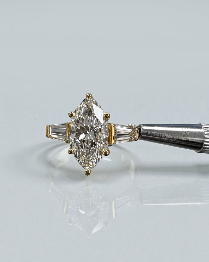 3ct marquise diamond ring trilogy worn on a hand to show scale.