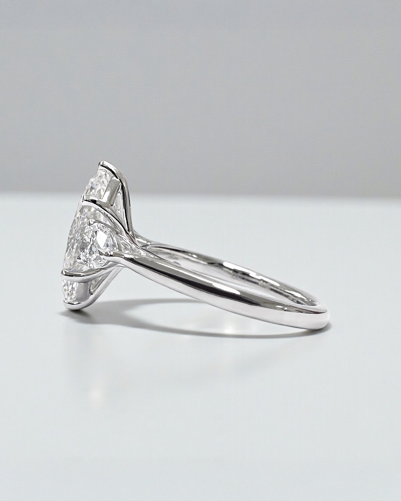 Close-up detail of a high-quality marquise diamond featuring pear side diamonds.