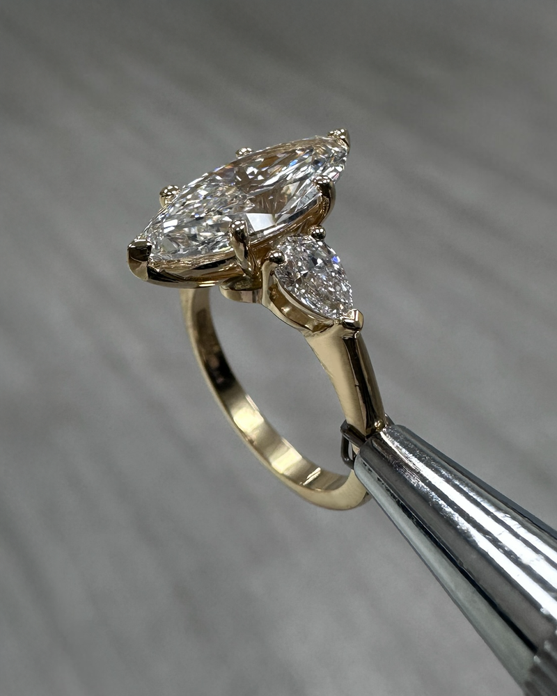 3ct marquise engagement ring diamond worn on a finger to show scale and sparkle.