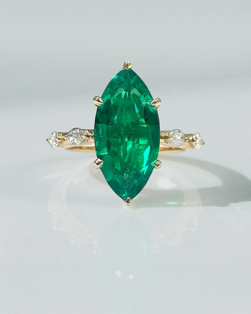 2.40ct green emerald marquise engagement ring in a solitaire setting.