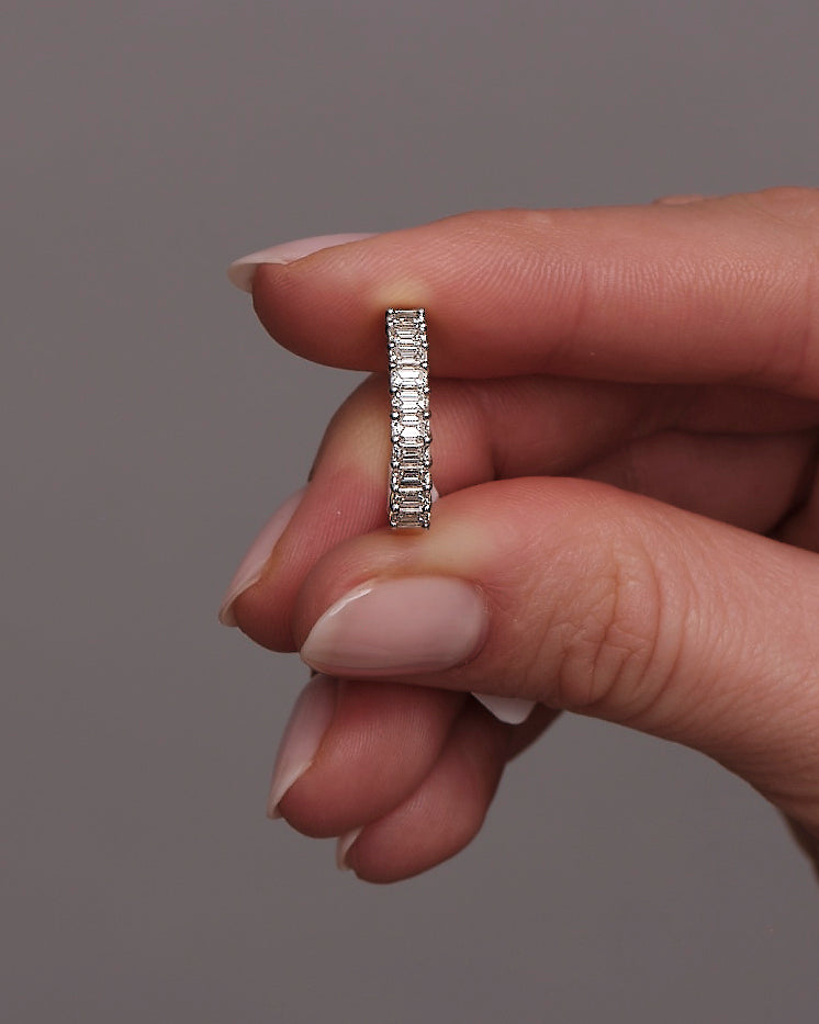 Close-up detail of the high-quality mini emerald cut diamond stones on this elegant band.
