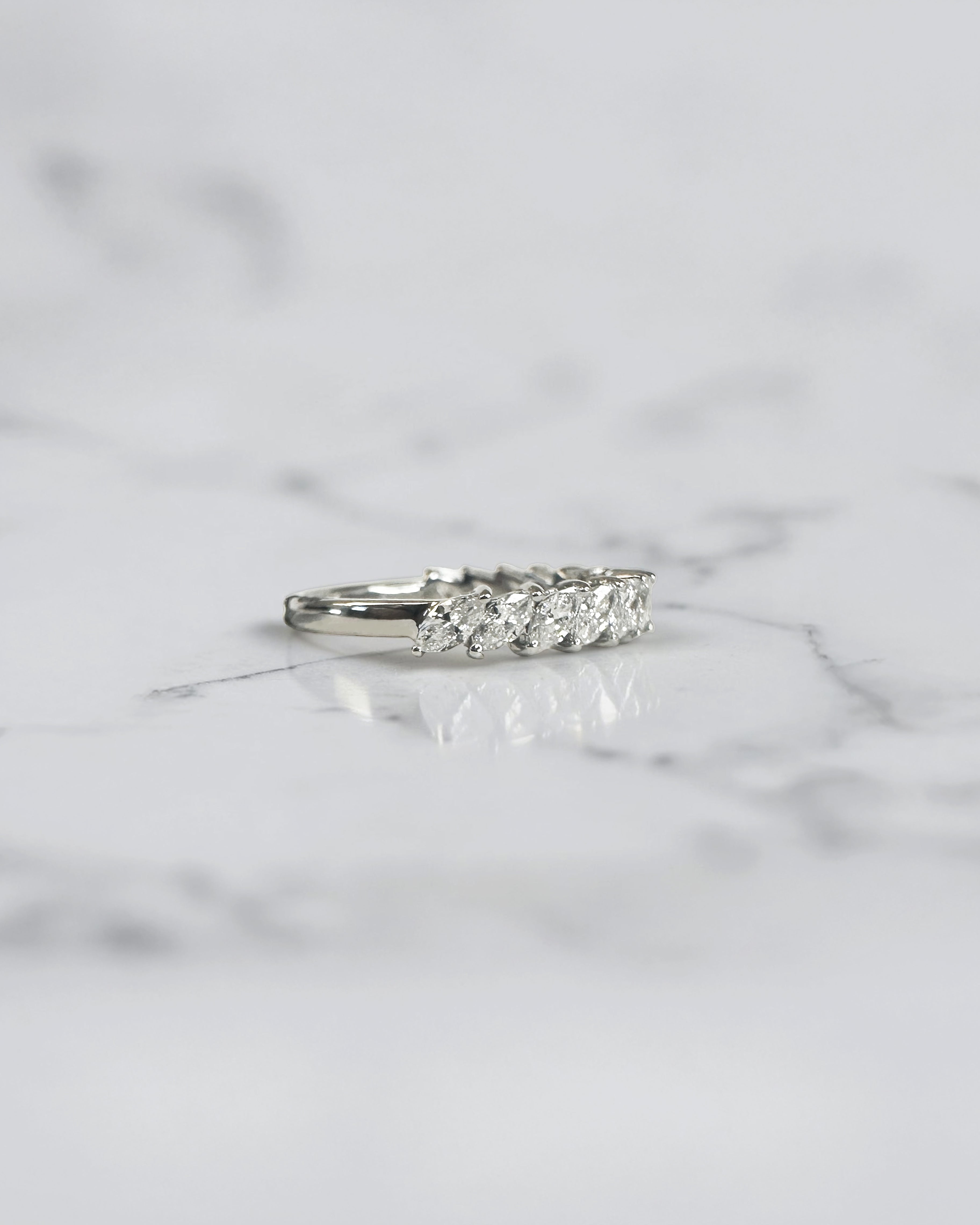 0.90ct slanted marquise cut diamond band with 0.90ct total diamonds in a claw setting, available in platinum or gold with lab grown or natural diamonds.