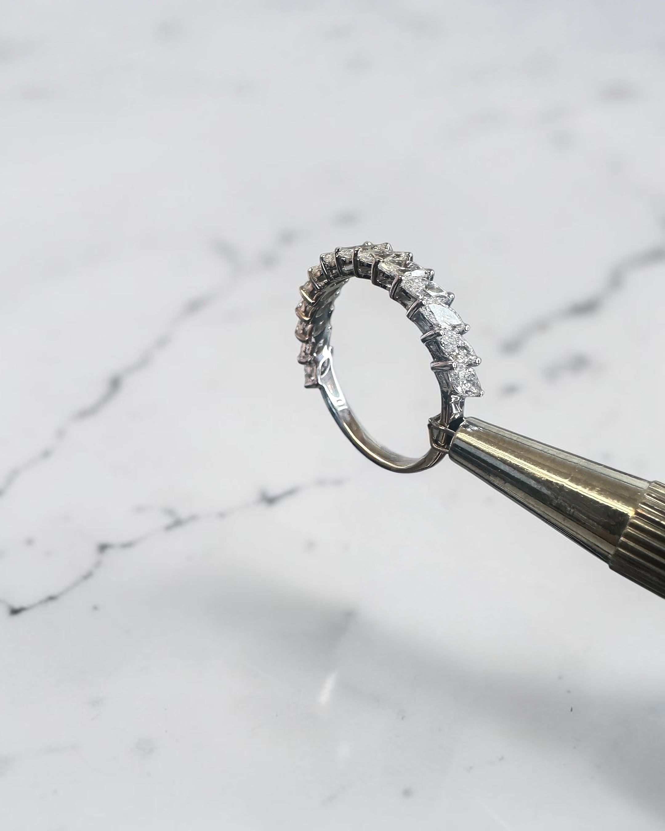 0.90ct slanted marquise cut diamond band with 0.90ct total diamonds in a claw setting, available in platinum or gold with lab grown or natural diamonds.