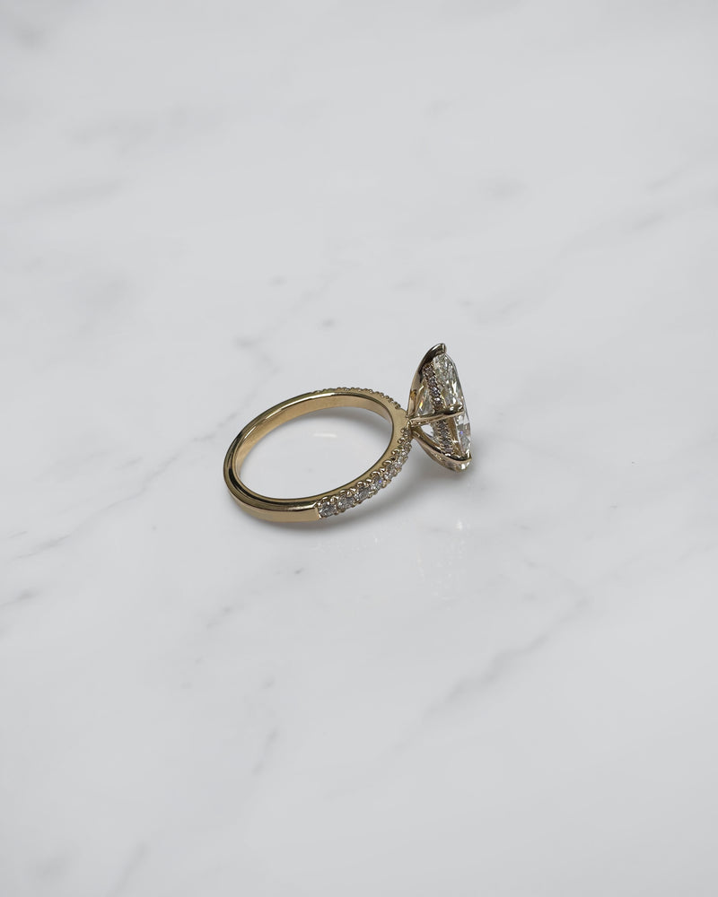 5ct marquise cut lab grown diamond engagement ring with hidden halo and diamond shoulders in floating setting