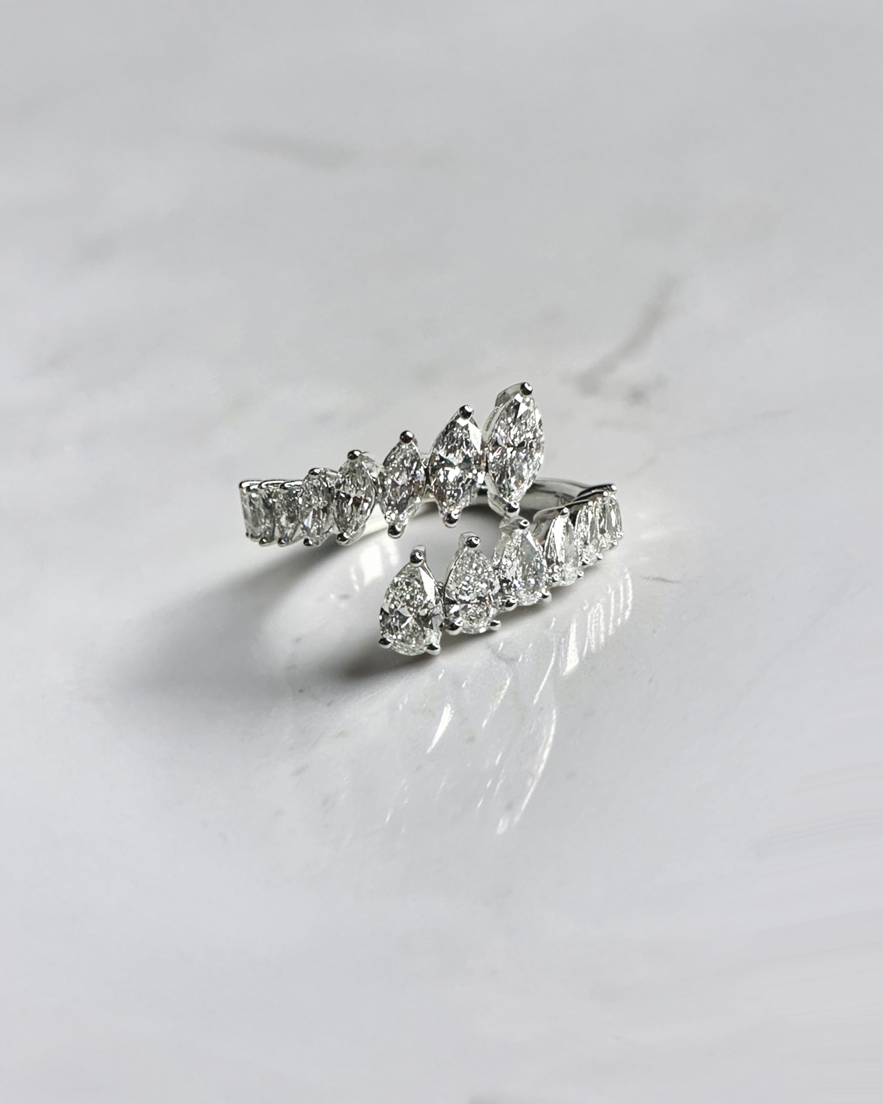 Marquise and Pear cut wrap diamond dress ring featuring approximately 1.75ct marquise and pear cut diamonds in an open wrap design. Available in lab or natural diamonds.