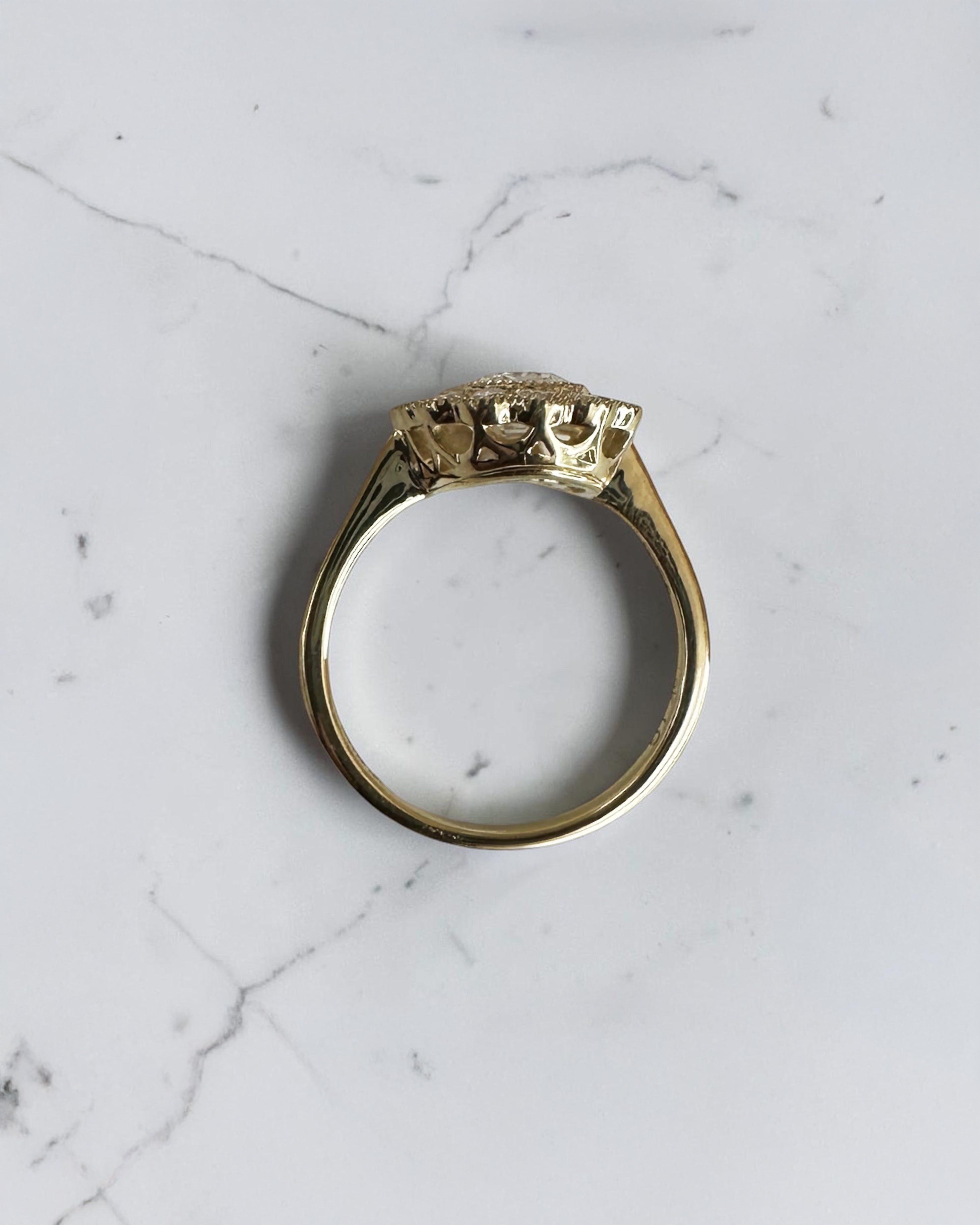 2ct elongated old mine cut cushion lab grown diamond engagement ring with bezel setting and vintage scalloped diamond halo

