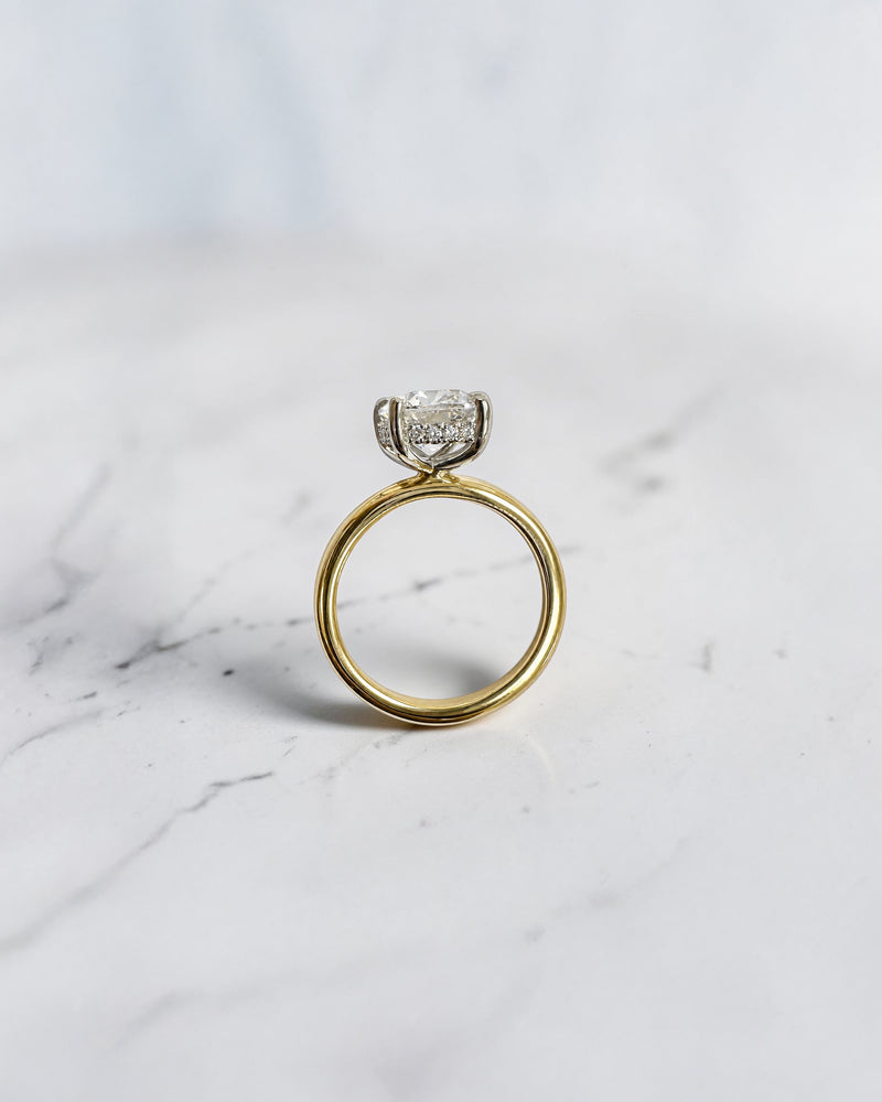 2.90ct old mine cut elongated cushion diamond engagement ring with hidden halo in two tone 18kt yellow gold band and platinum setting