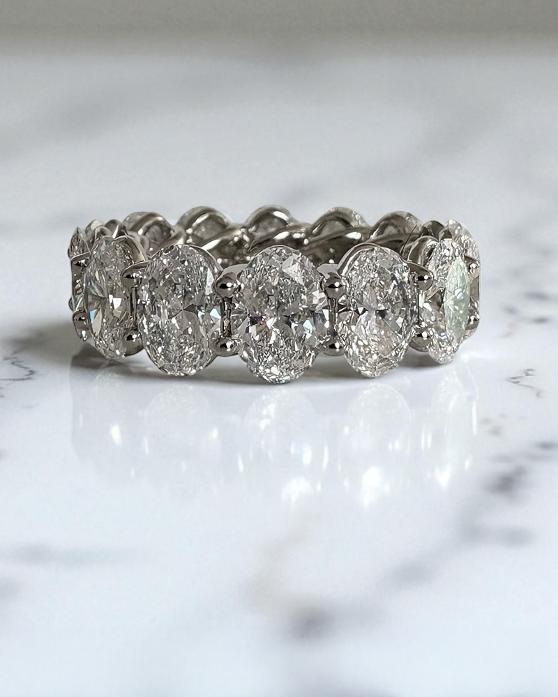 Perspective view of a premium 10ct oval cut diamond band for exclusive oval diamond engagement rings bridal sets.