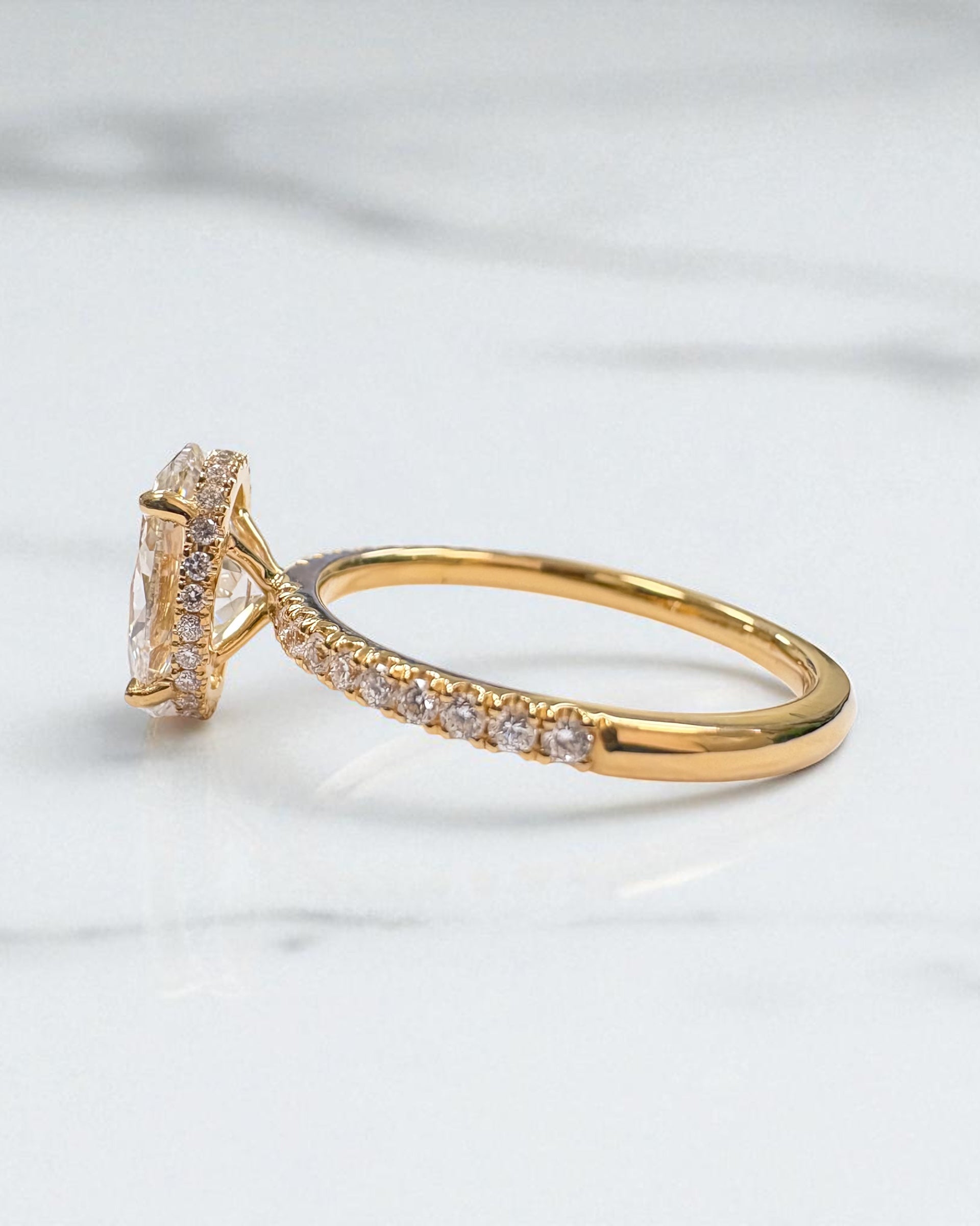 2ct lab grown oval cut diamond hidden halo shoulder band, 18kt yellow gold 