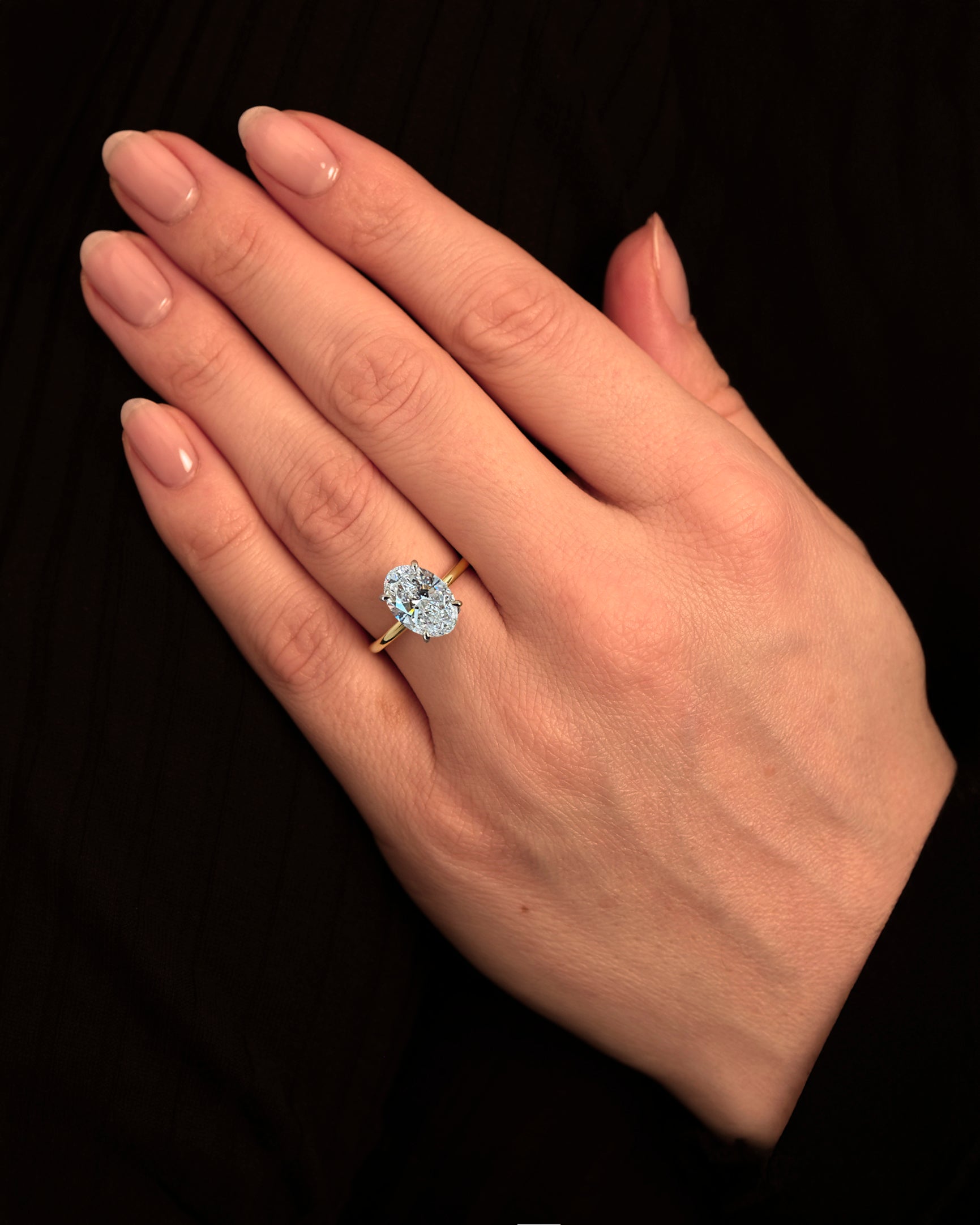 3.50ct Oval Cut Lab Grown Diamond Solitaire with Diamond Hidden Halo Engagement Ring on hand