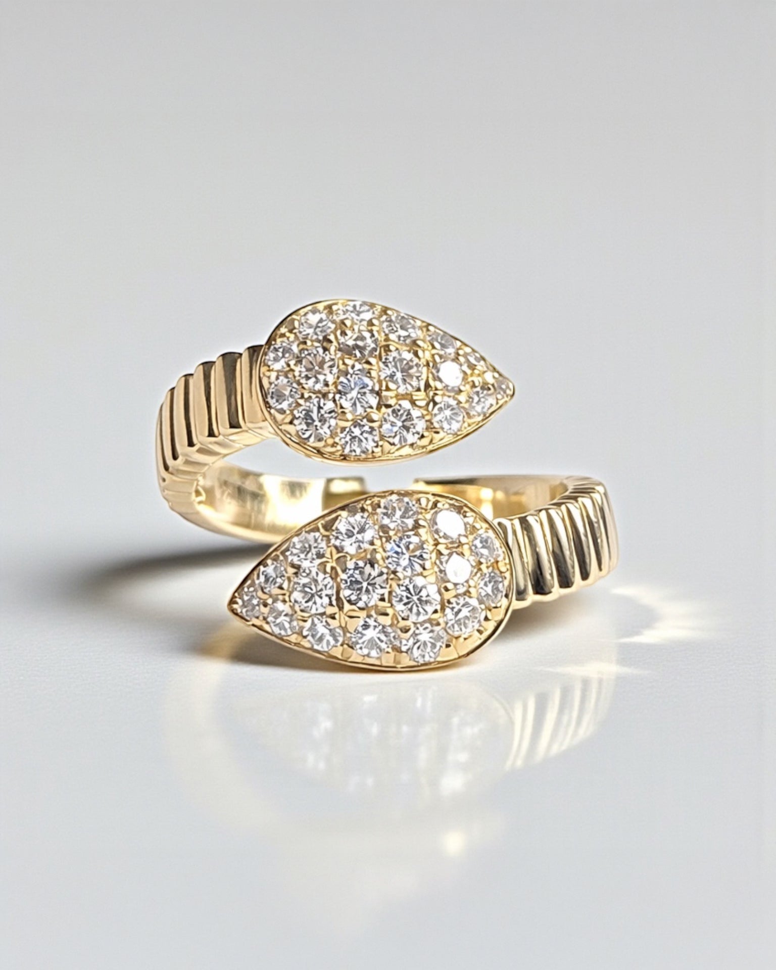 Wrap around serpent diamond ring in 9ct yellow and white gold with 0.70ct natural G SI1+ diamonds.