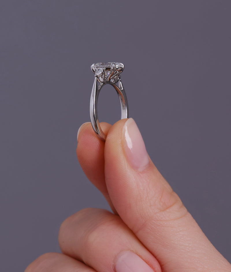 2ct oval cut lab grown diamond trilogy engagement ring with pear cut side diamonds by Layla Diamonds.