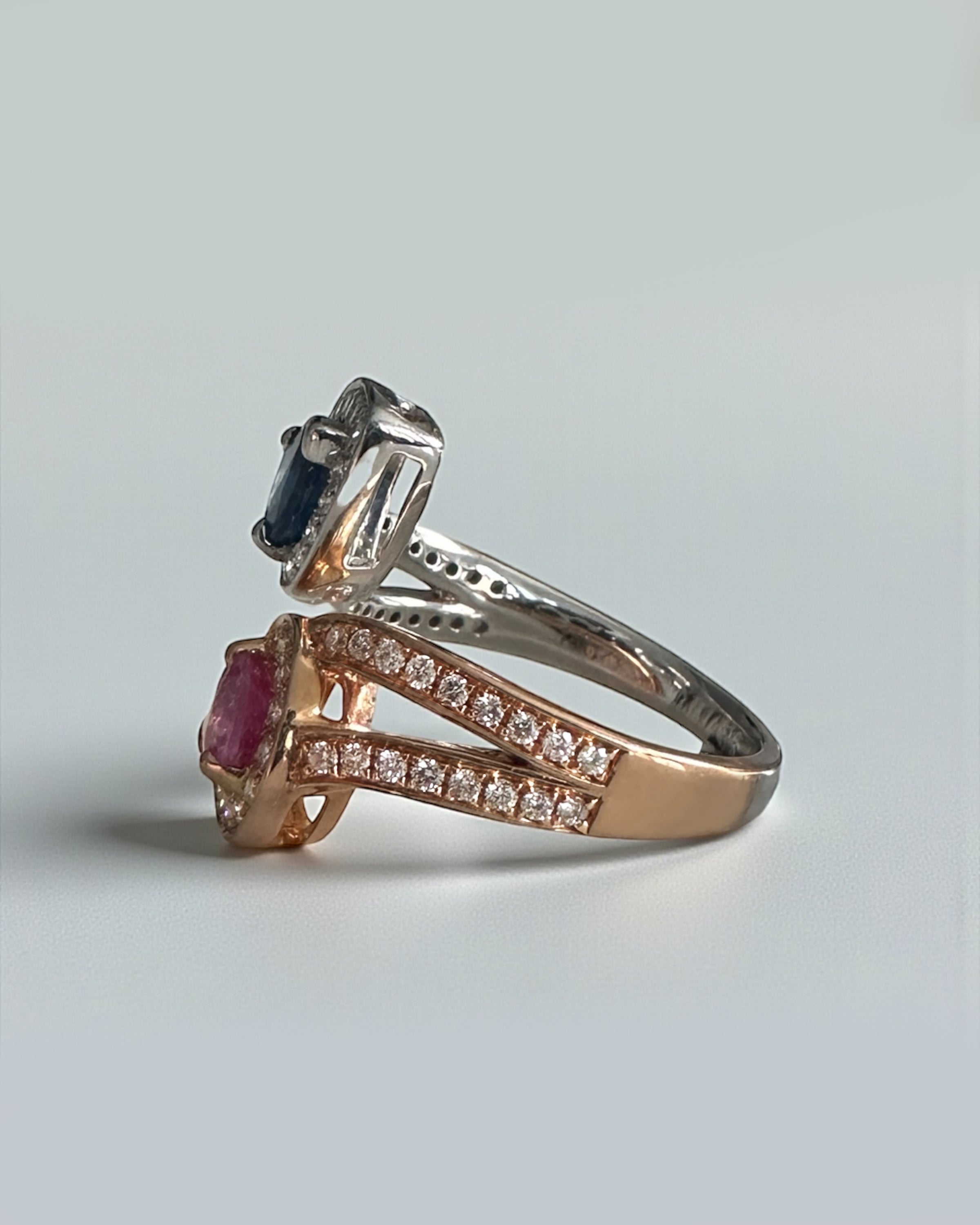 Pink and blue pear cut sapphire two stone ring with diamond halos in 18ct rose and white gold 