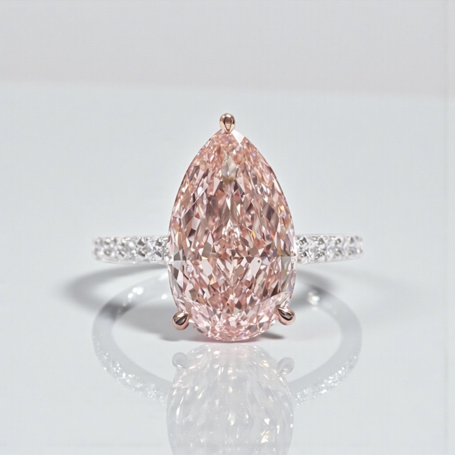 Pear shaped engagement ring with 3ct lab grown pink diamond, hidden halo and diamond set platinum band