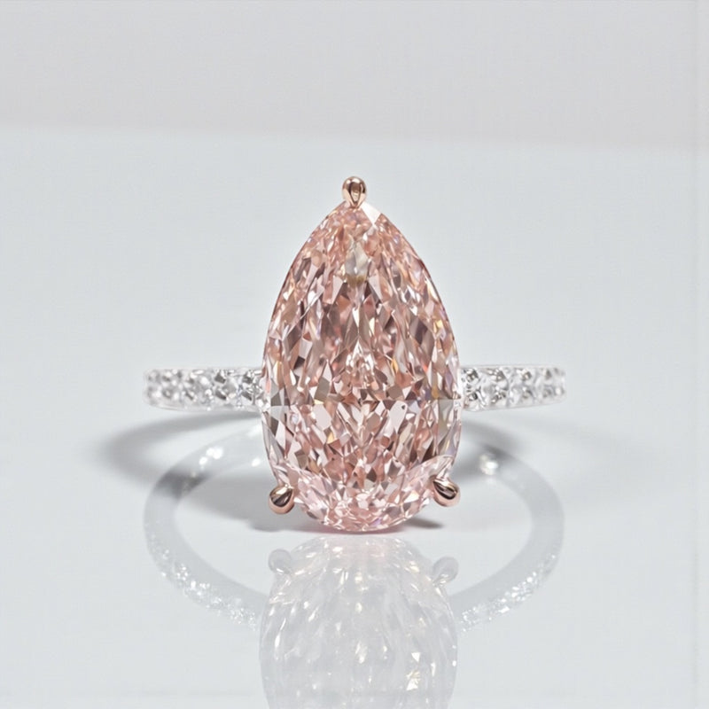 Pear shaped engagement ring with 3ct lab grown pink diamond, hidden halo and diamond set platinum band
