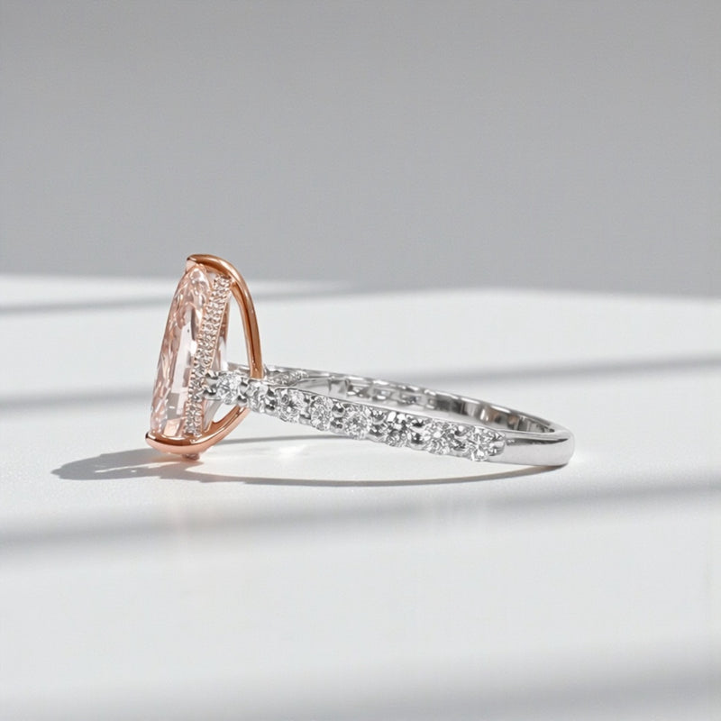 Pear shaped engagement ring with 3ct lab grown pink diamond, hidden halo and diamond set platinum band