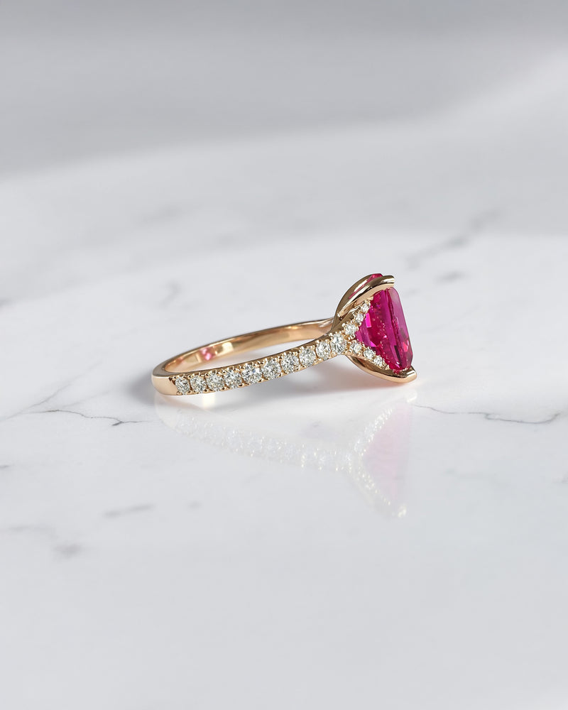 5.80ct elongated cushion cut pink lab grown sapphire engagement ring with diamond shoulders in 18kt rose gold.