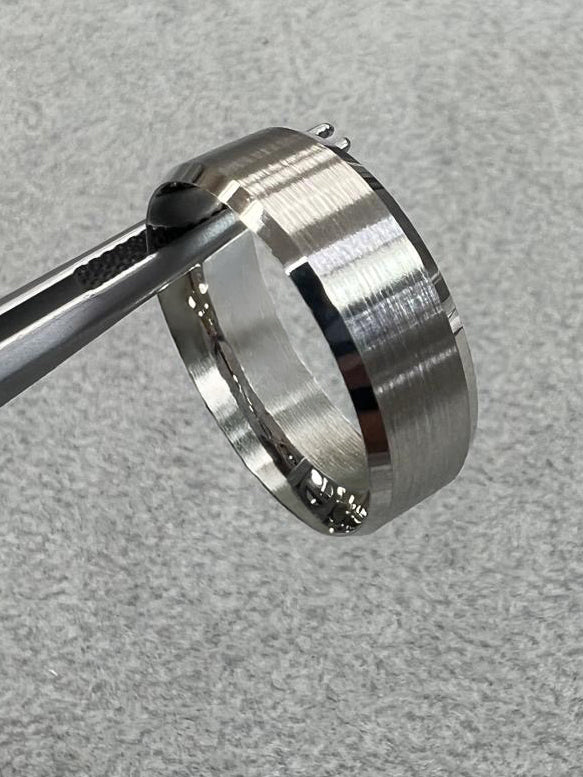 A striking 7mm bevelled edge polished ring from our premium platinum engagement band collection.