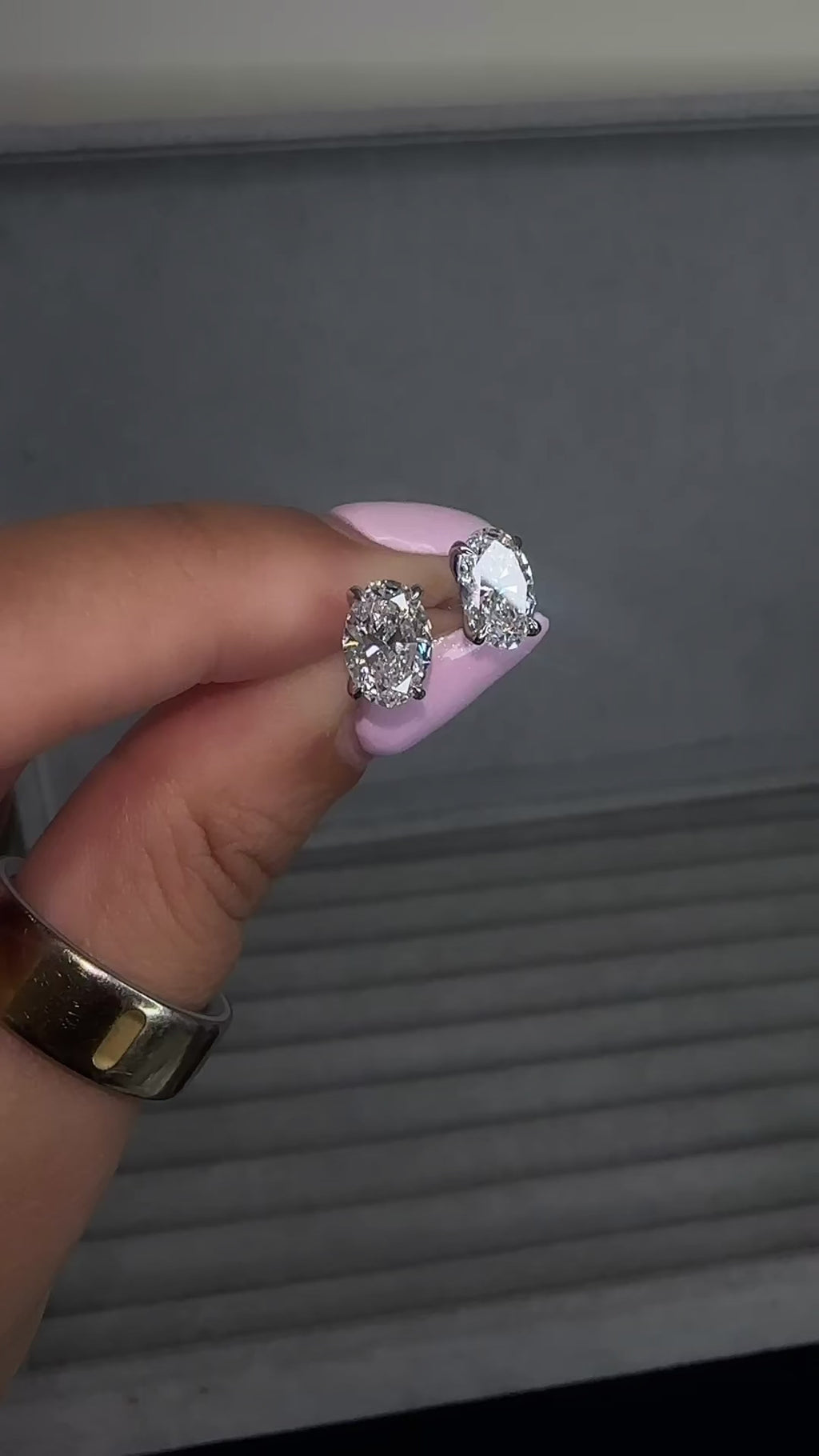 3ct lab grown oval diamond stud earrings featuring two 1.50ct oval brilliant cut diamonds in a classic four prong setting.