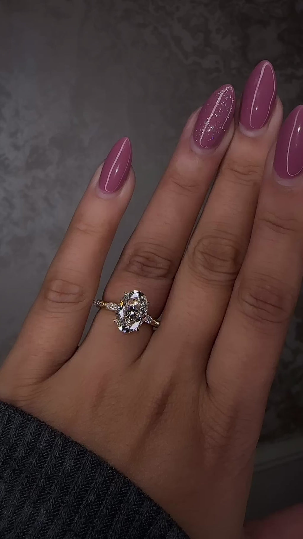 3ct oval cut lab grown diamond marquise spaced band engagement ring on hand, hidden halo 18kt yellow gold made in London by Layla Diamonds