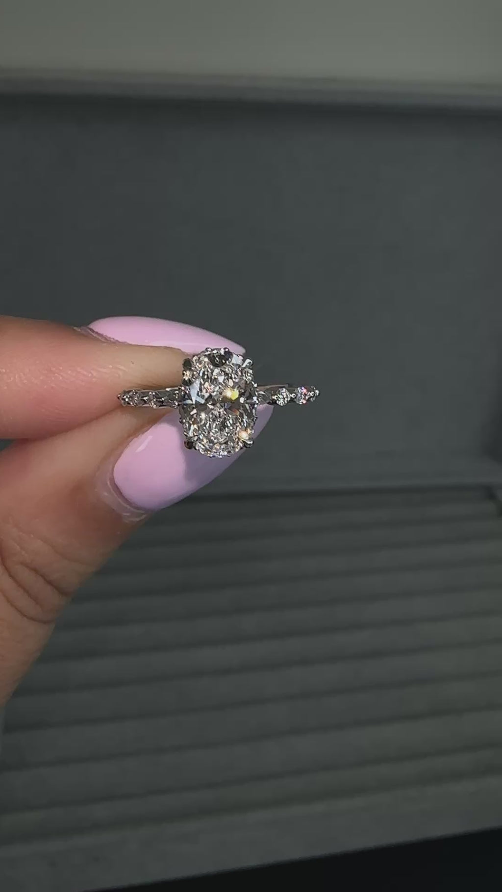 1.50ct oval cut lab grown diamond engagement ring with marquise and round diamond shoulders and hidden halo