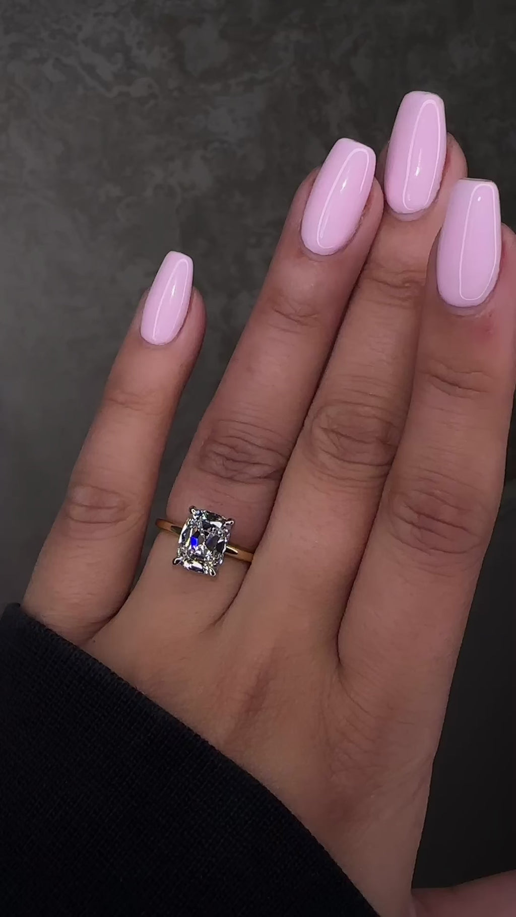 2.90ct old mine cut elongated cushion diamond engagement ring with hidden halo in two tone 18kt yellow gold band and platinum setting on hand