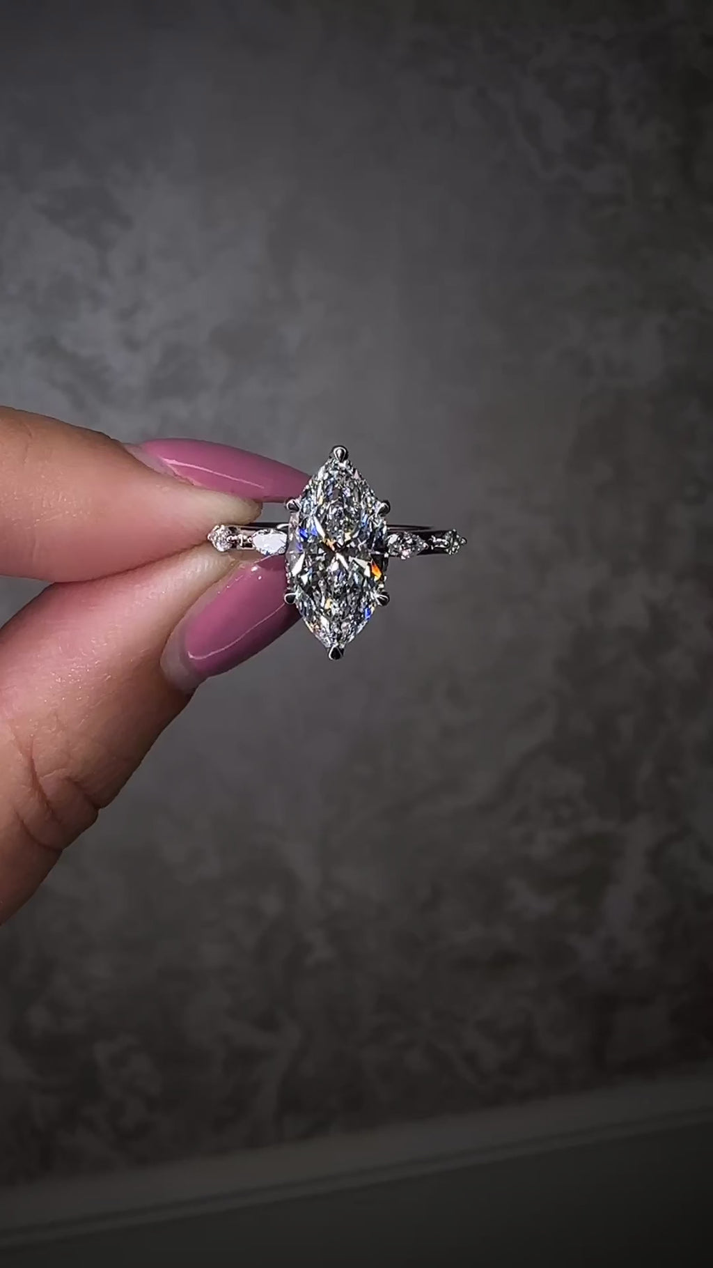 3ct marquise cut lab grown diamond set on a spaced marquise cut band engagement ring platinum 18kt gold