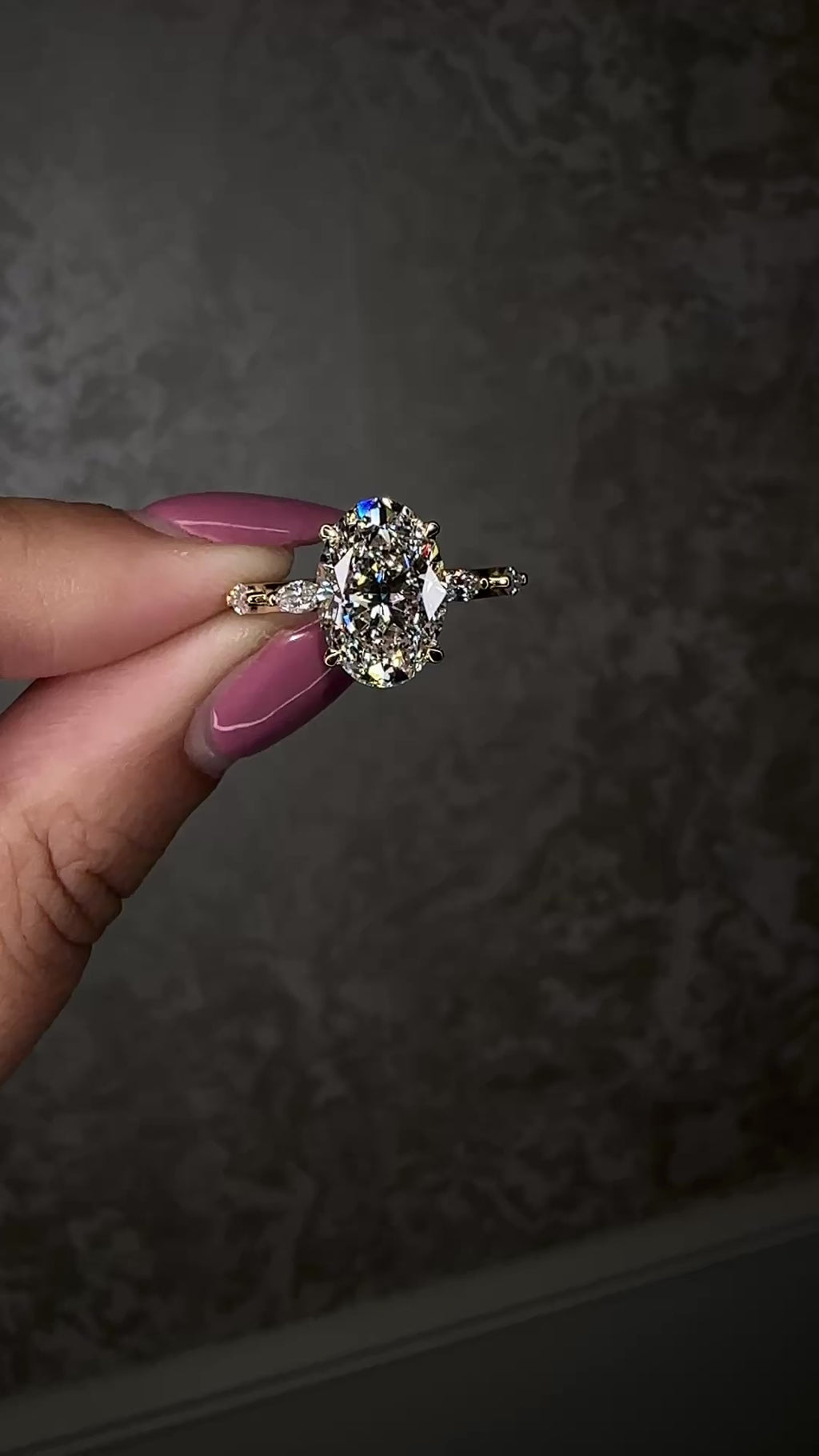 3ct oval cut lab grown diamond marquise spaced band engagement ring on hand, hidden halo 18kt yellow gold made in London by Layla Diamonds