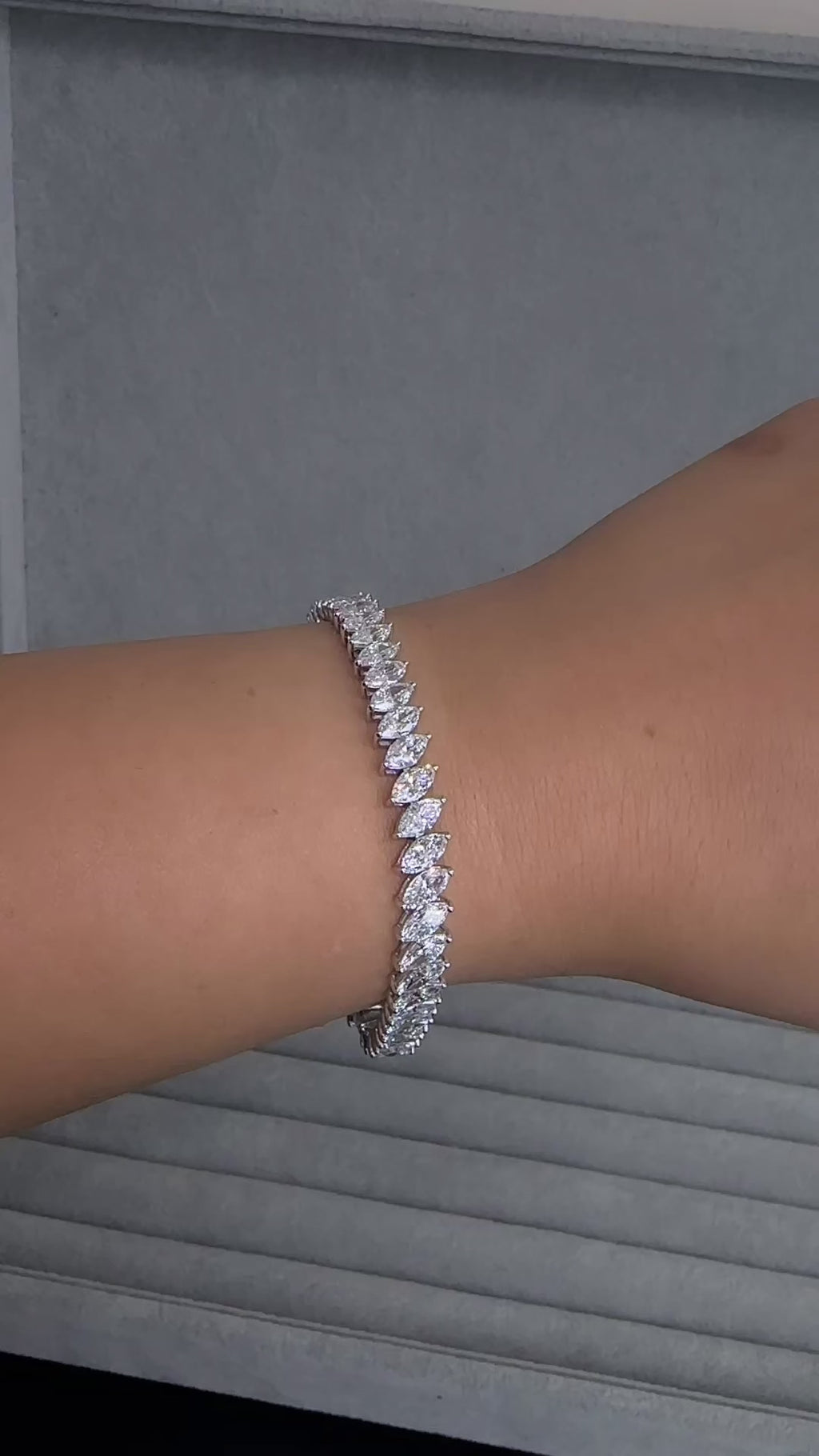 12ct slanted marquise cut diamond tennis bracelet in white gold featuring sparkling marquise diamonds in a modern slanted setting.