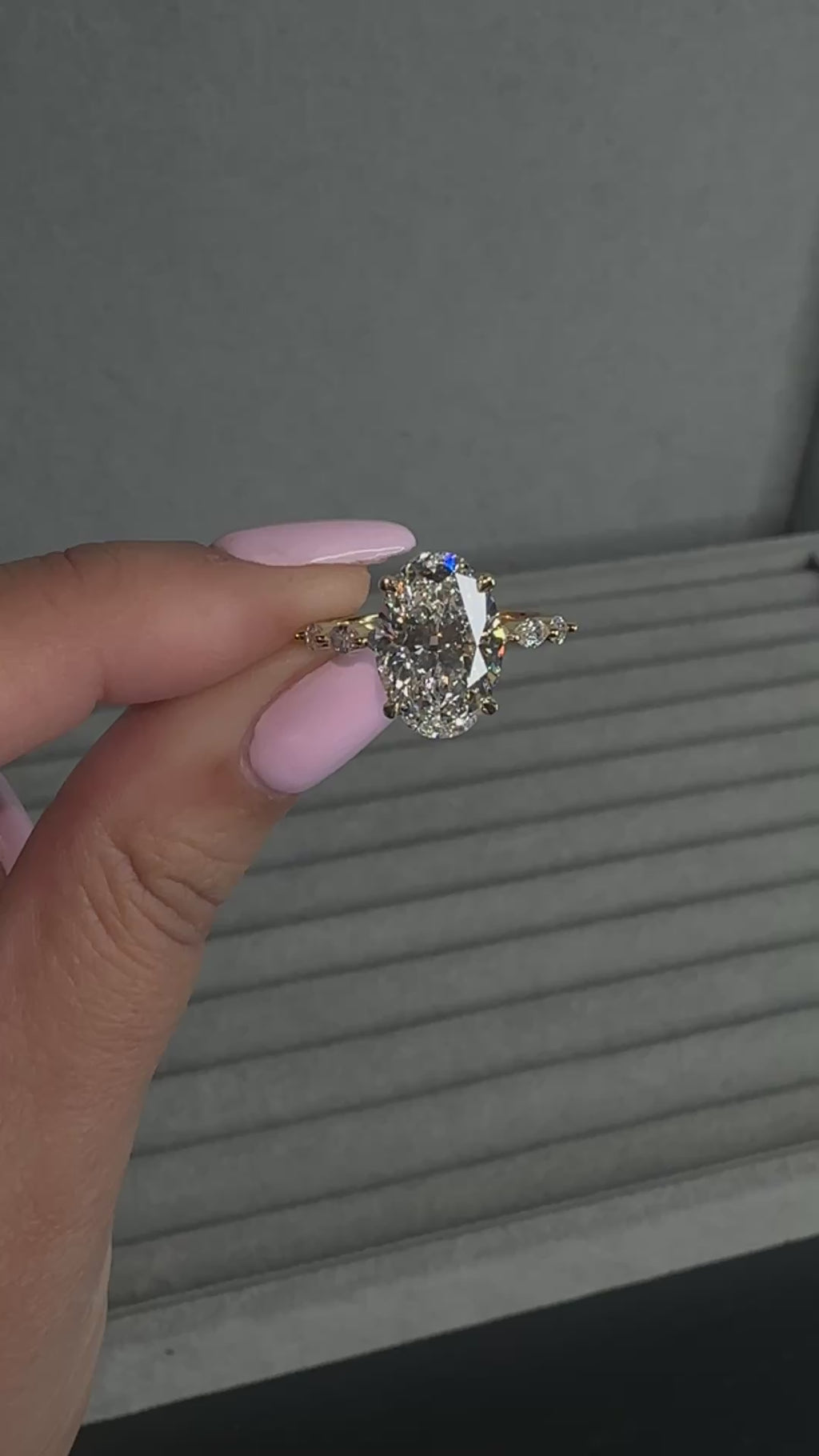 4ct oval cut lab grown diamond engagement ring with marquise cut diamond band in yellow gold, four claw setting, 4.40ct total diamond weight, handcrafted in London