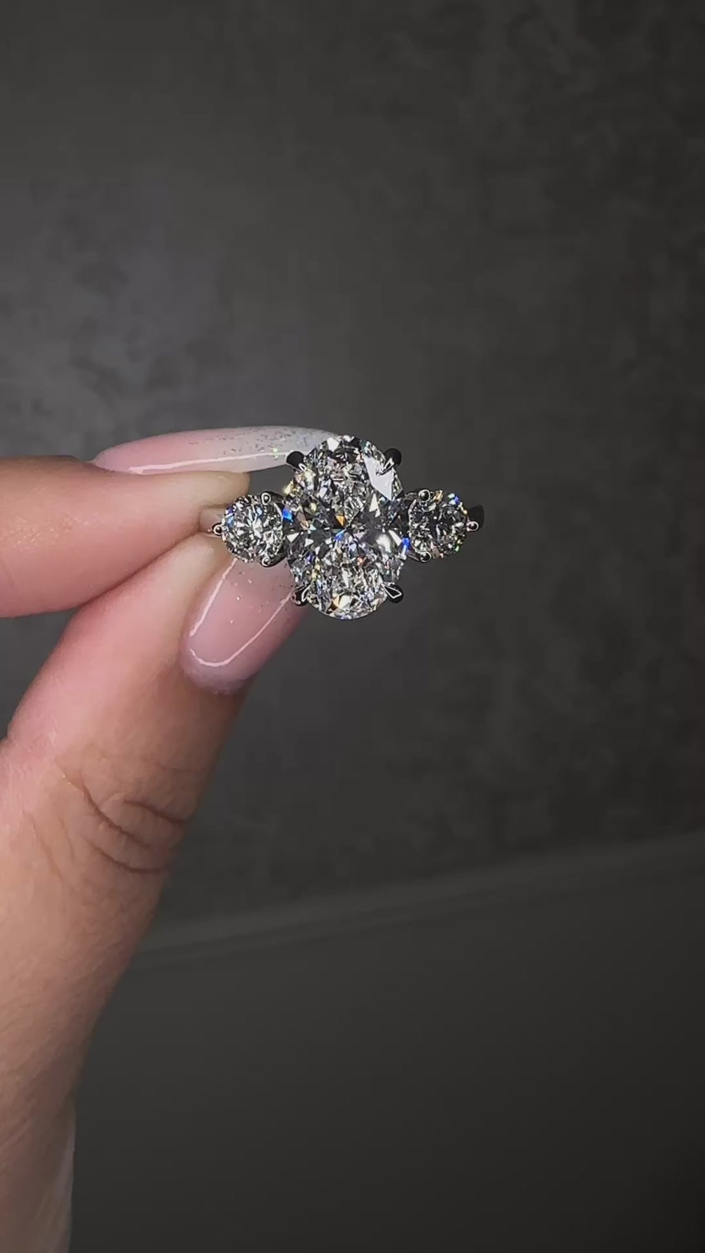3.50ct lab grown oval cut diamond and round brilliant trilogy engagement ring