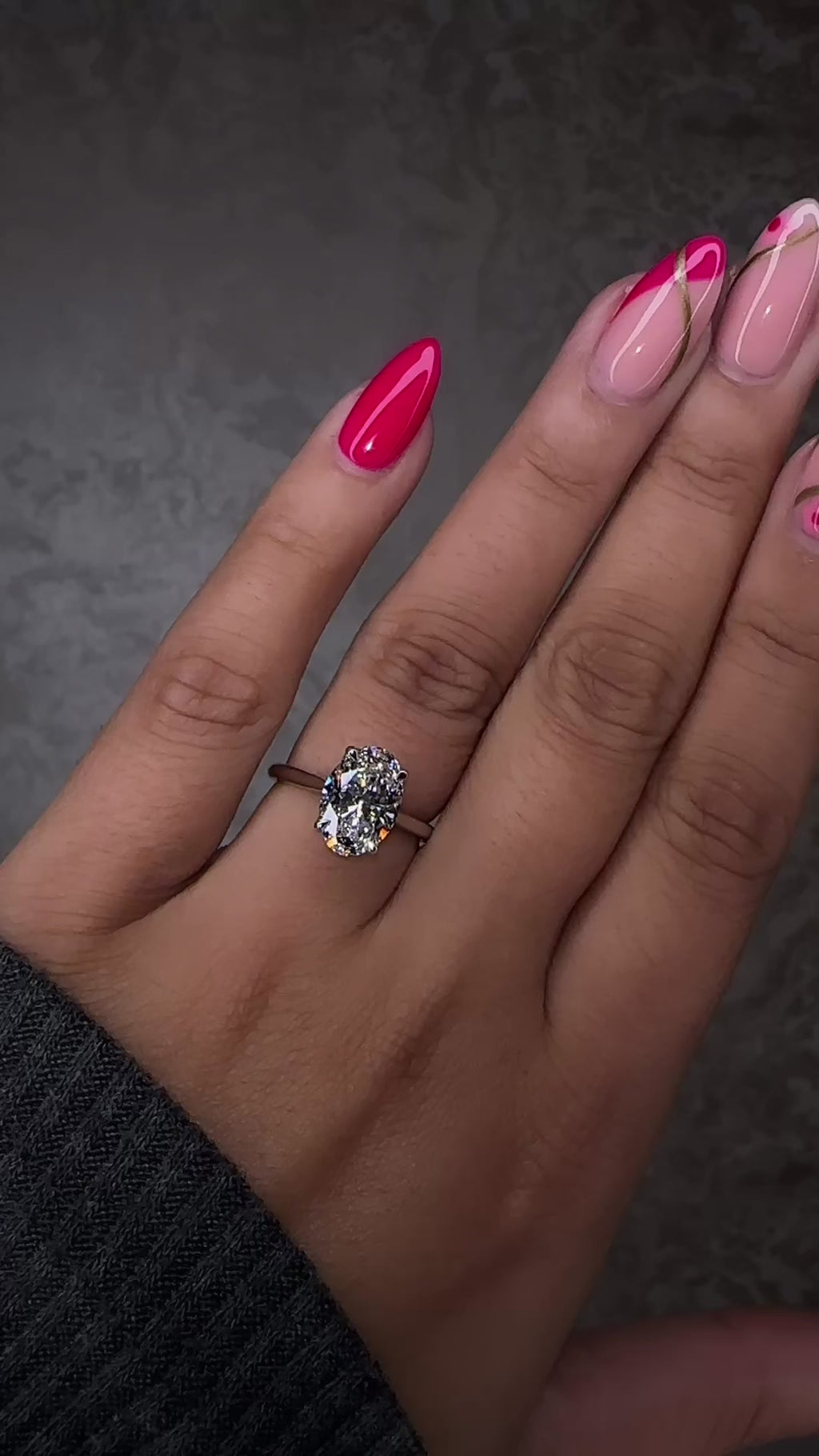 Platinum 3ct oval cut diamond solitaire engagement ring on hand with lotus head and diamond bridge — handcrafted by Layla Diamonds London