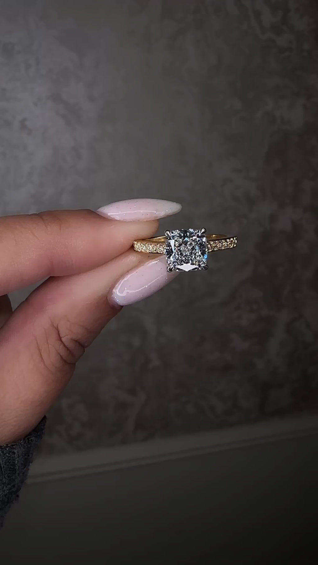 Two tone cushion cut diamond engagement ring, featuring platinum head and channel set band 18kt yellow gold by Layla Diamonds