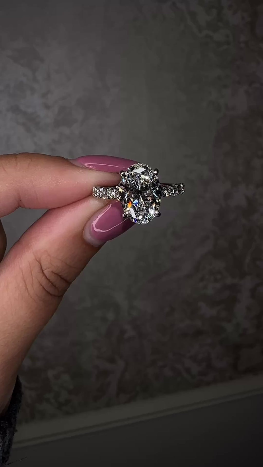 3ct oval cut lab grown diamond u prong setting, cathedral engagement ring in platinum on hand