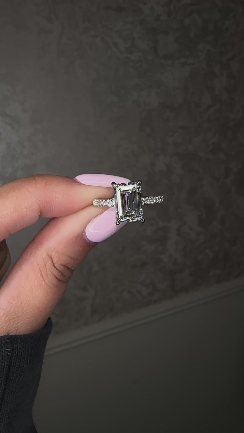 3ct emerald cut diamond engagement ring with open diamond prongs and pavé diamond band in platinum, total 3.38ct