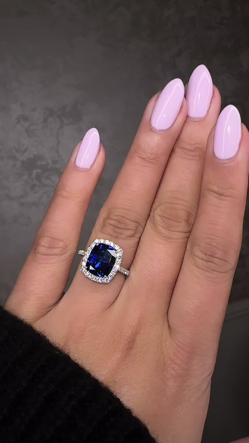 Striking 5ct lab grown blue sapphire halo diamond ring with diamond shoulders. Available in 9kt or 18kt gold or platinum. Made to order. Layla Diamonds London