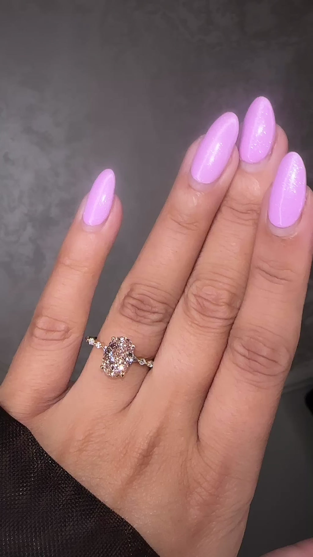 3ct pink oval cut lab grown diamond engagement ring with a floating setting, marquise and round diamond band in 18ct yellow gold, handcrafted in London by Layla Diamonds.