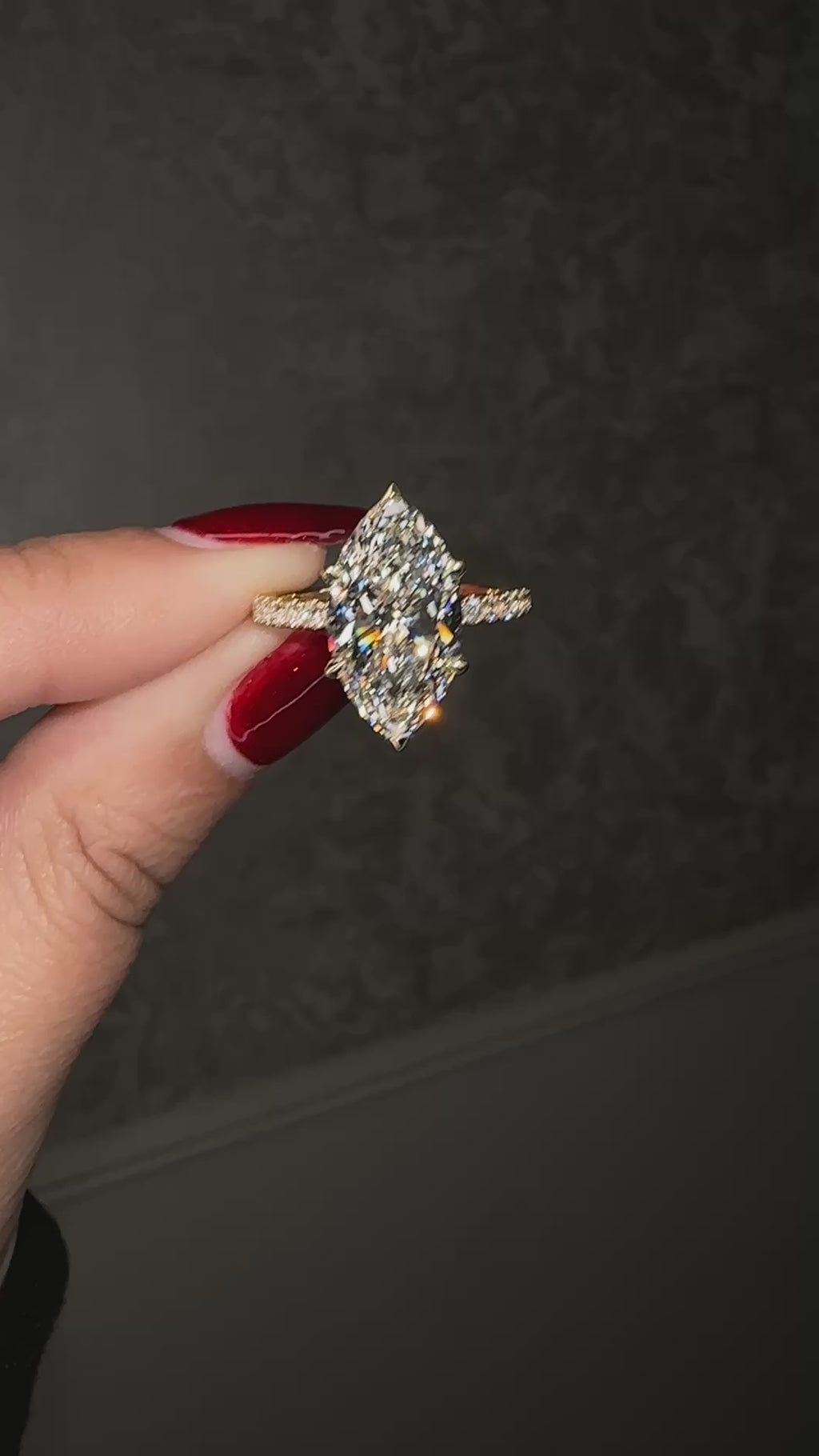 5ct marquise cut lab grown diamond engagement ring with hidden halo and diamond shoulders in floating setting