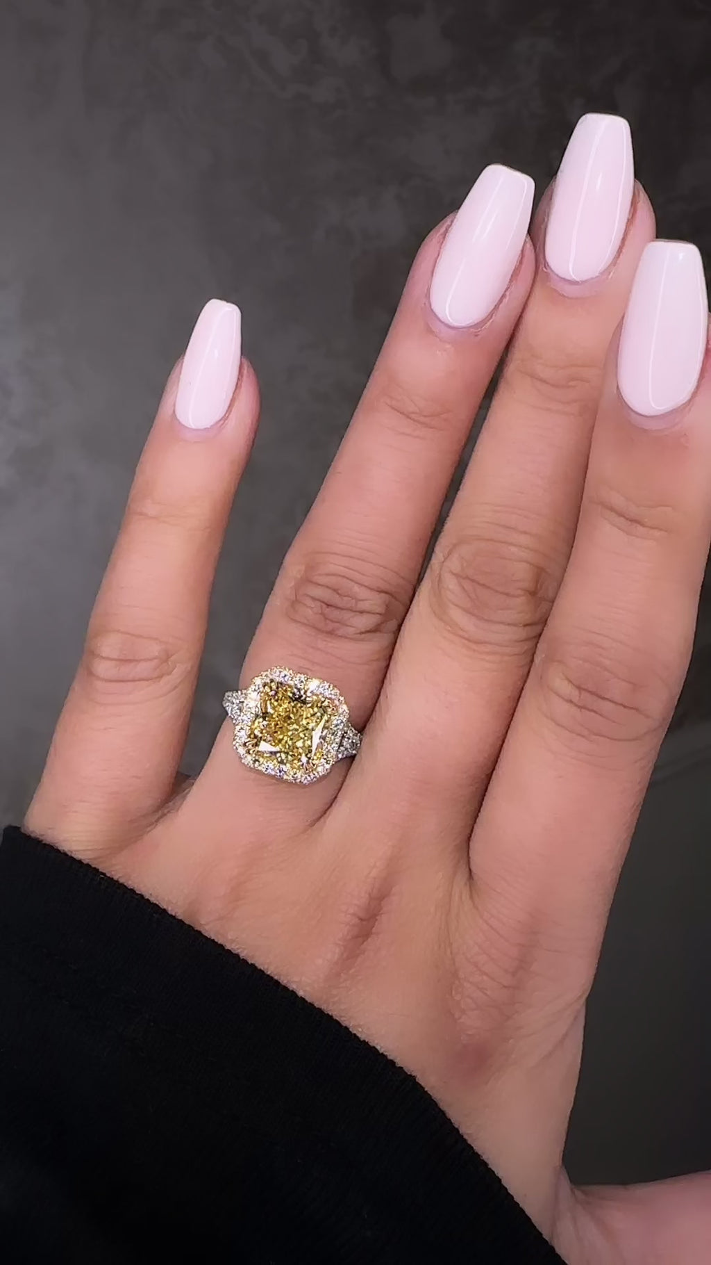 5ct square lab grown cushion cut yellow diamond engagement ring with 3D diamond halo and split shoulder band in 18kt yellow and white gold on hand