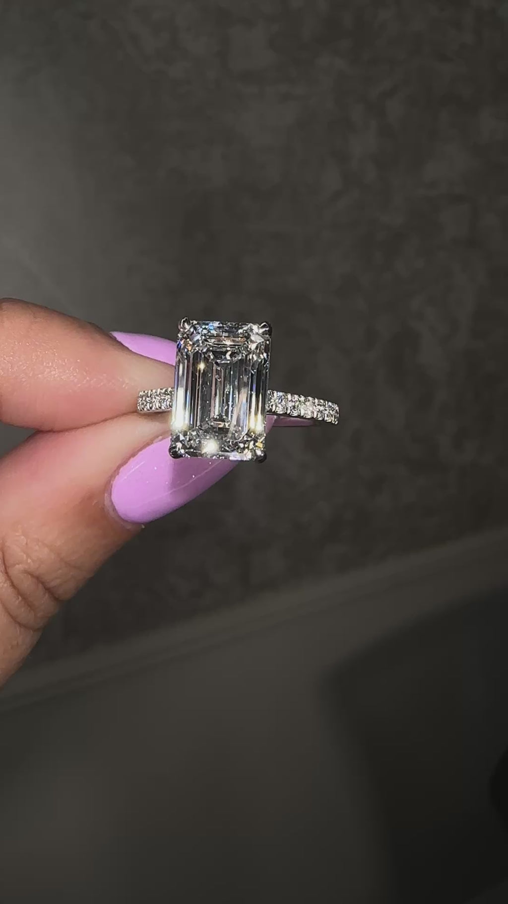 5ct emerald cut lab grown diamond engagement ring with cathedral setting, diamond shoulders, hidden halo and 5.45ct total diamonds by Layla Diamonds.