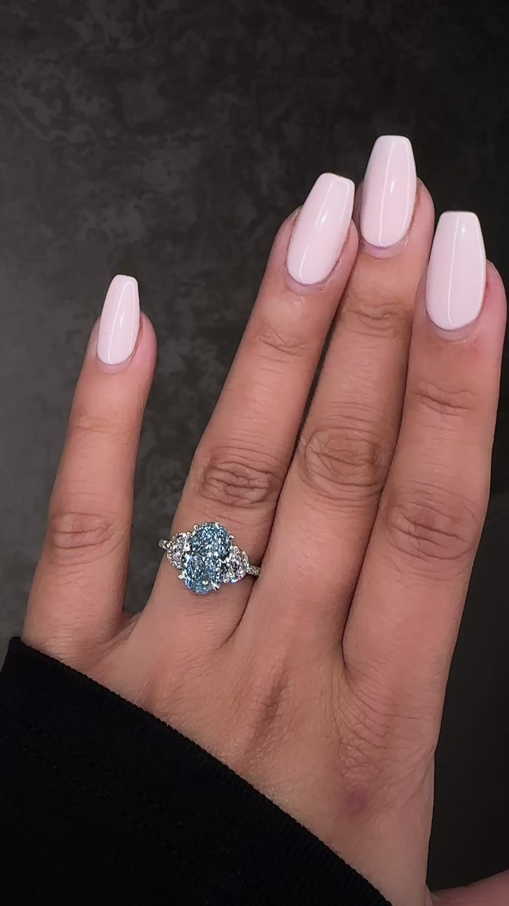 3.70ct baby fancy blue oval cut lab grown diamond trilogy engagement ring with half moon side stones and diamond set tapered shoulders in platinum setting 