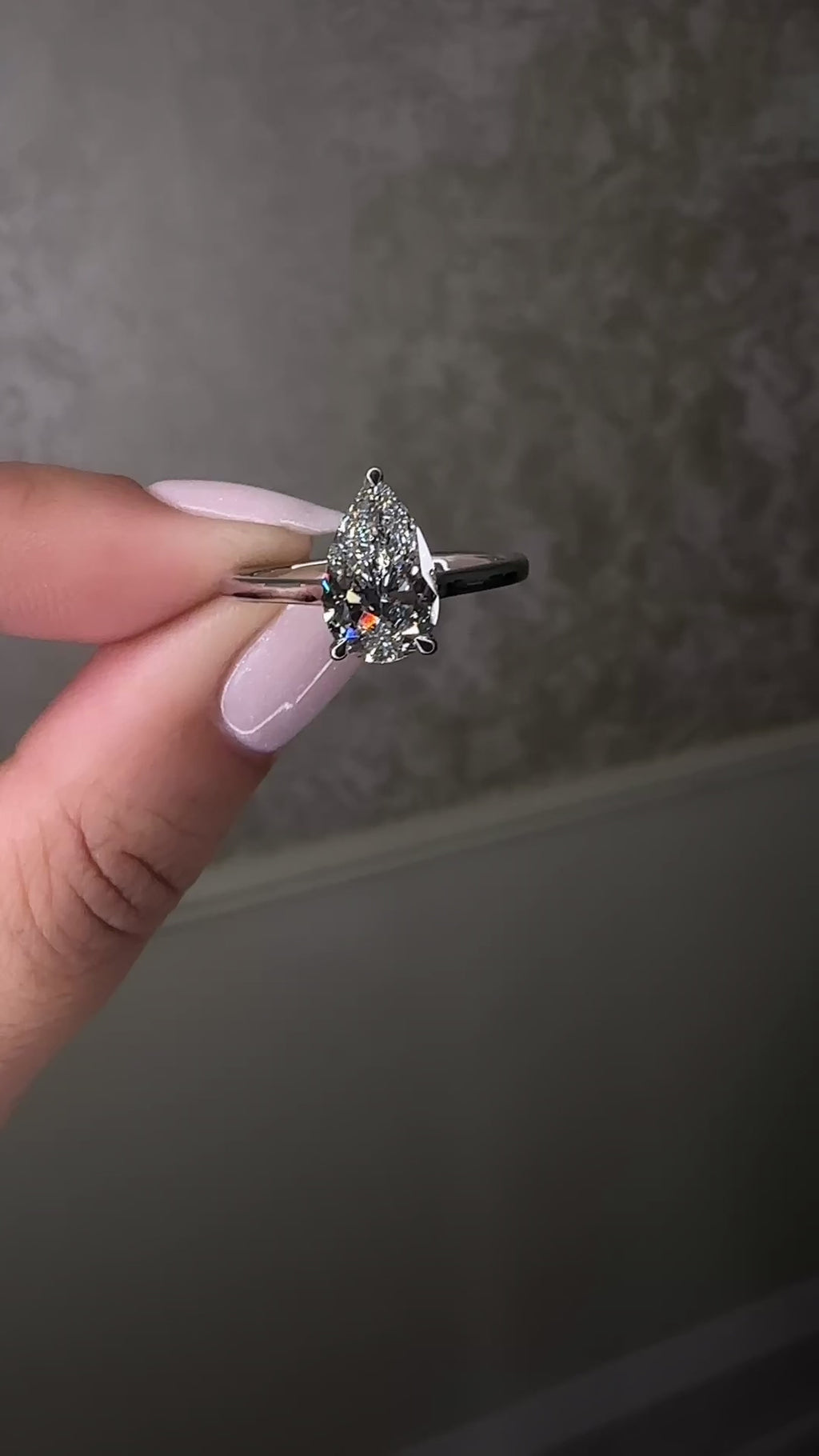 2ct pear cut lab grown diamond cathedral solitaire engagement ring with a plain band in platinum or 18kt gold, elegant and timeless design