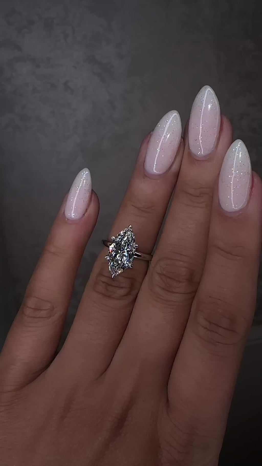 3.50ct marquise cut lab grown diamond engagement ring with hidden halo and floating head in plain band, handcrafted in London by Layla Diamonds, in platinum on hand