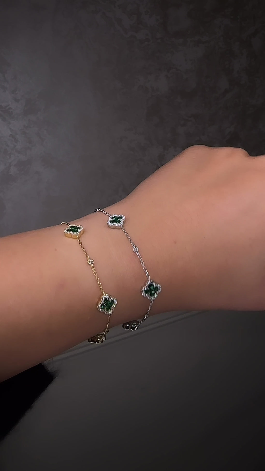Green emerald Diamond chain clover motif gold bracelet fine jewellery, London, Layla Diamonds on wrist