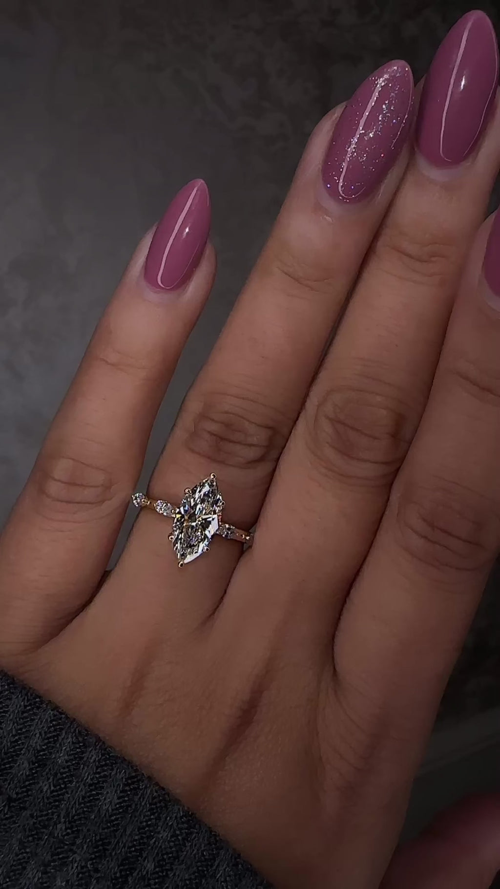 2ct marquise cut lab grown diamond marquise band spaced band hidden halo 18kt yellow gold engagement ring on hand 