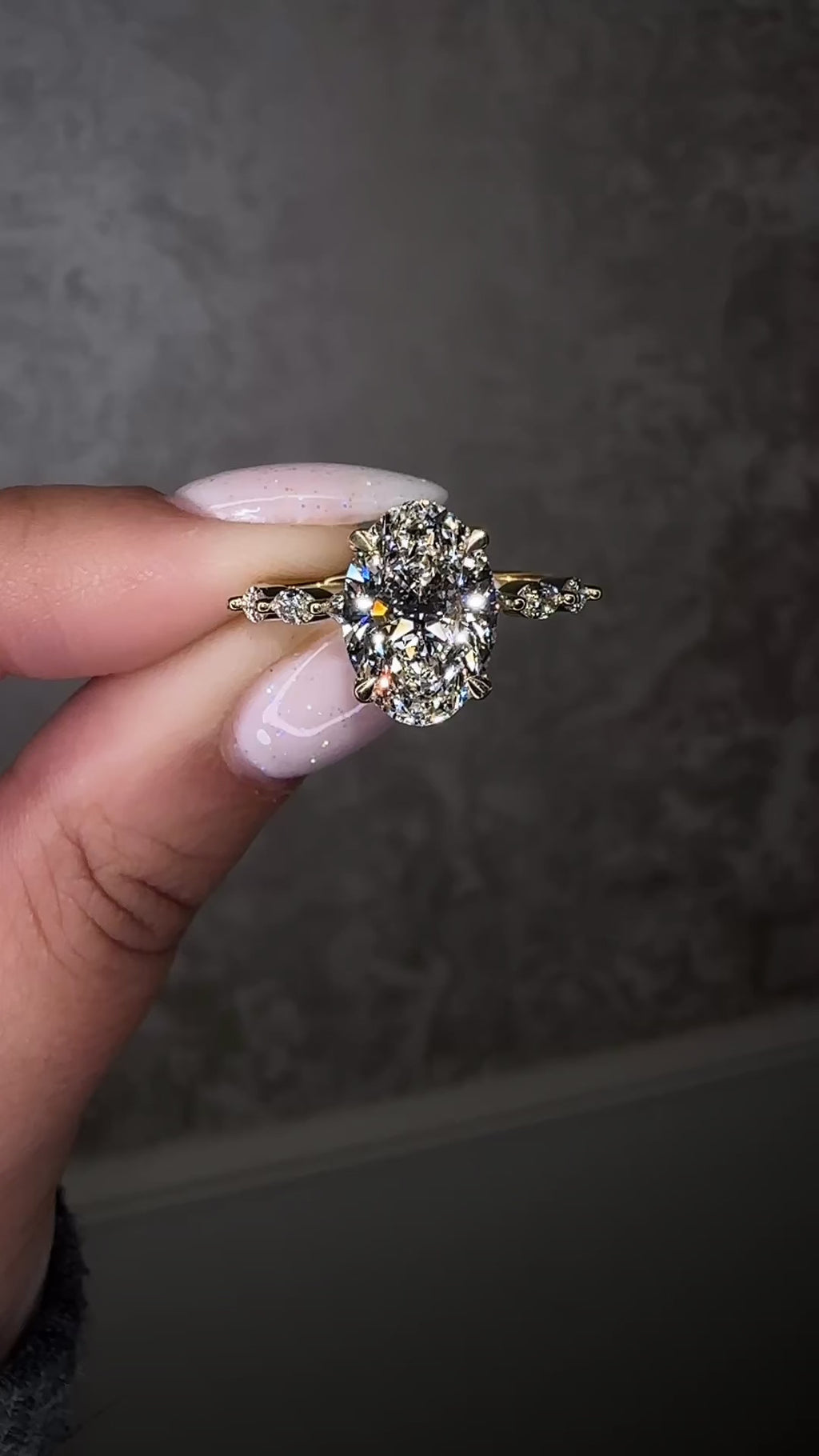 2ct oval cut diamond vs 3ct Oval cut diamond on hand Marquise Band