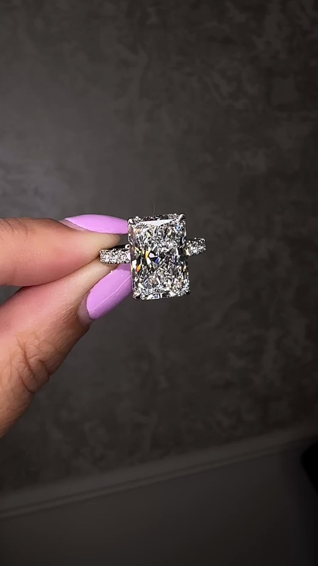 7ct radiant cut lab grown diamond engagement ring with diamond shoulder band, floating setting and wrap around hidden halo, handmade in London.