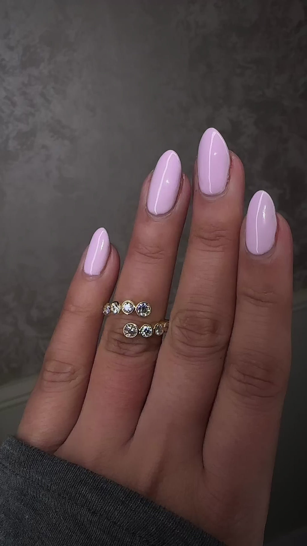 Bezel set diamond bubble wrap ring with round brilliant diamonds on hand