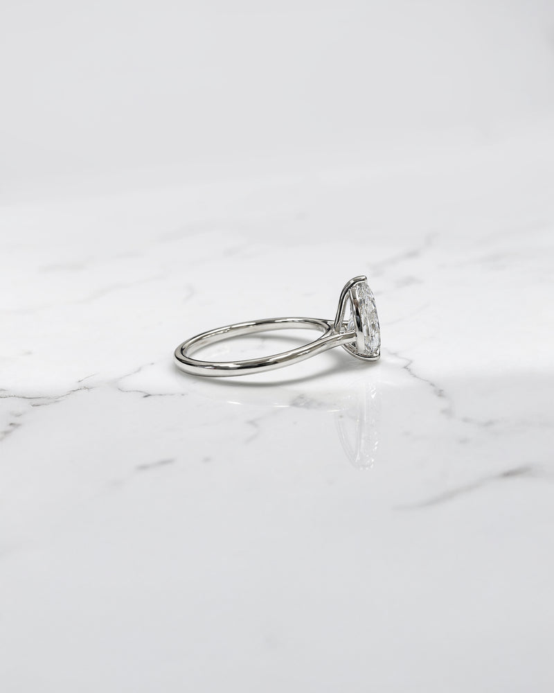 2ct pear cut lab grown diamond cathedral solitaire engagement ring with a plain band in platinum or 18kt gold, elegant and timeless design