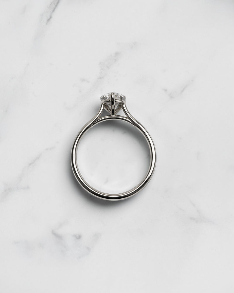 2ct pear cut lab grown diamond cathedral solitaire engagement ring with a plain band in platinum or 18kt gold, elegant and timeless design